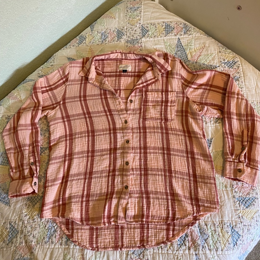 Women’s size M button up.